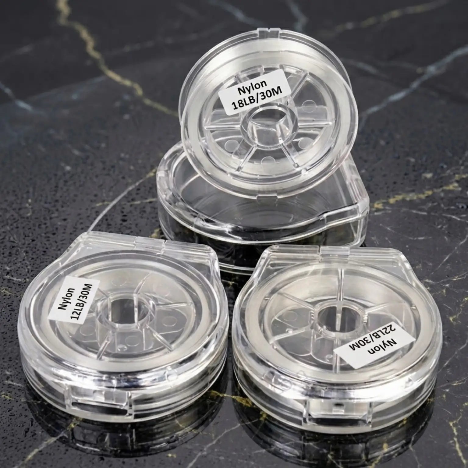 Trois bobines de tippet nylon Axon Saltwater 30 m en 12 lb, 18 lb et 22 lb pour la pêche à la mouche